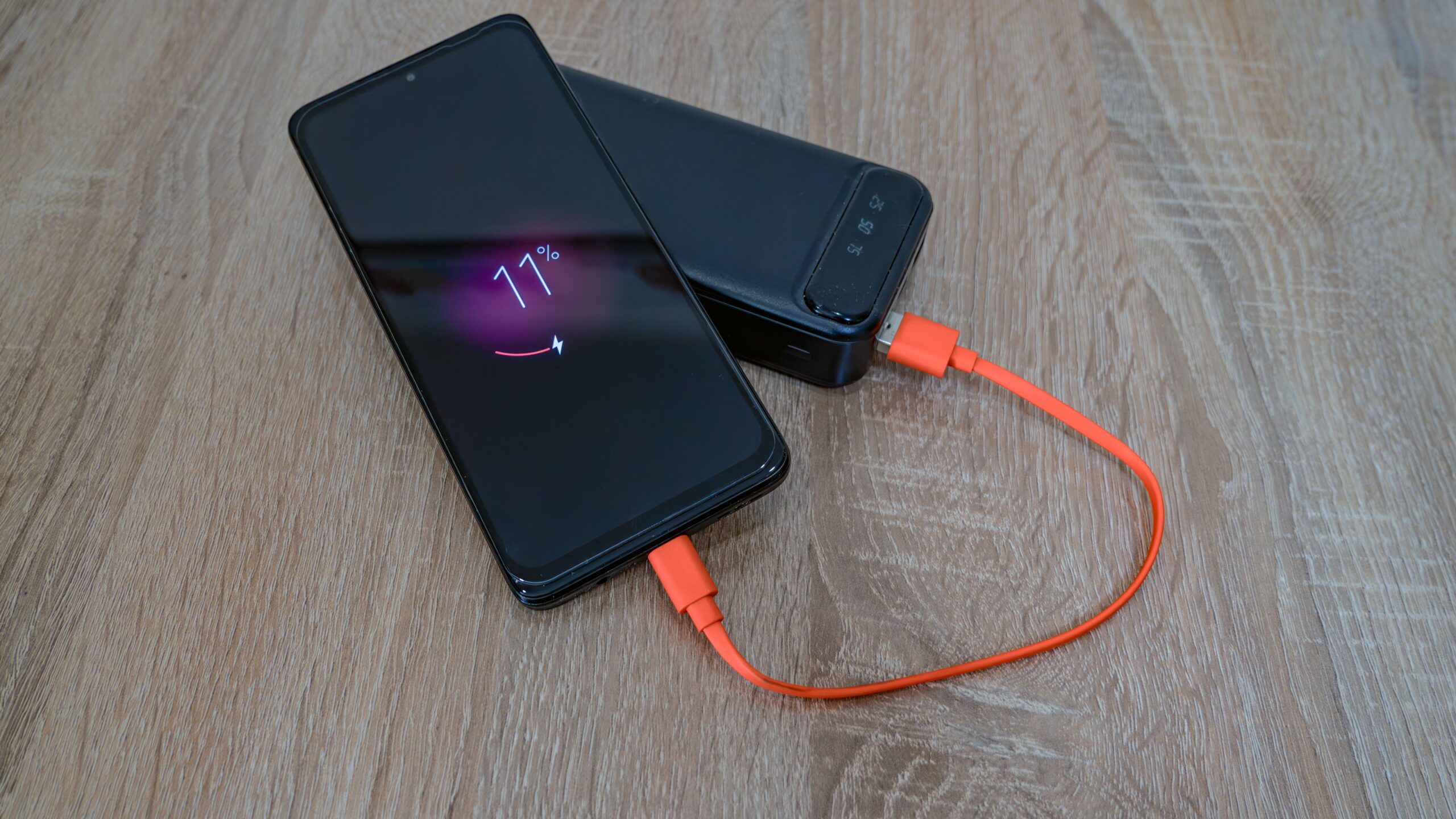 Portable power bank fast charging a smartphone