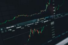 Trader analyzing charts on a computer workstation